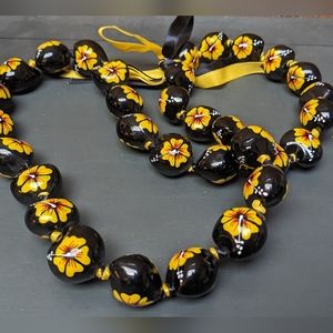 Hawaiian kukui nut necklace lei black yellow hibiscus flowers